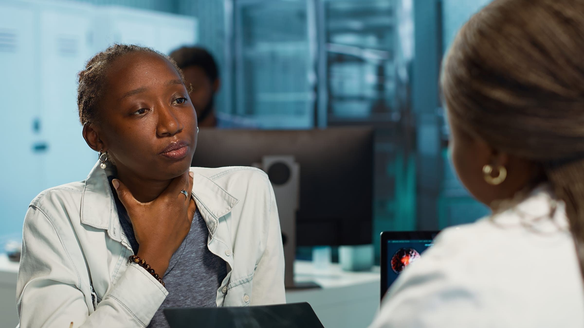Colleagues in discussion in an office setting