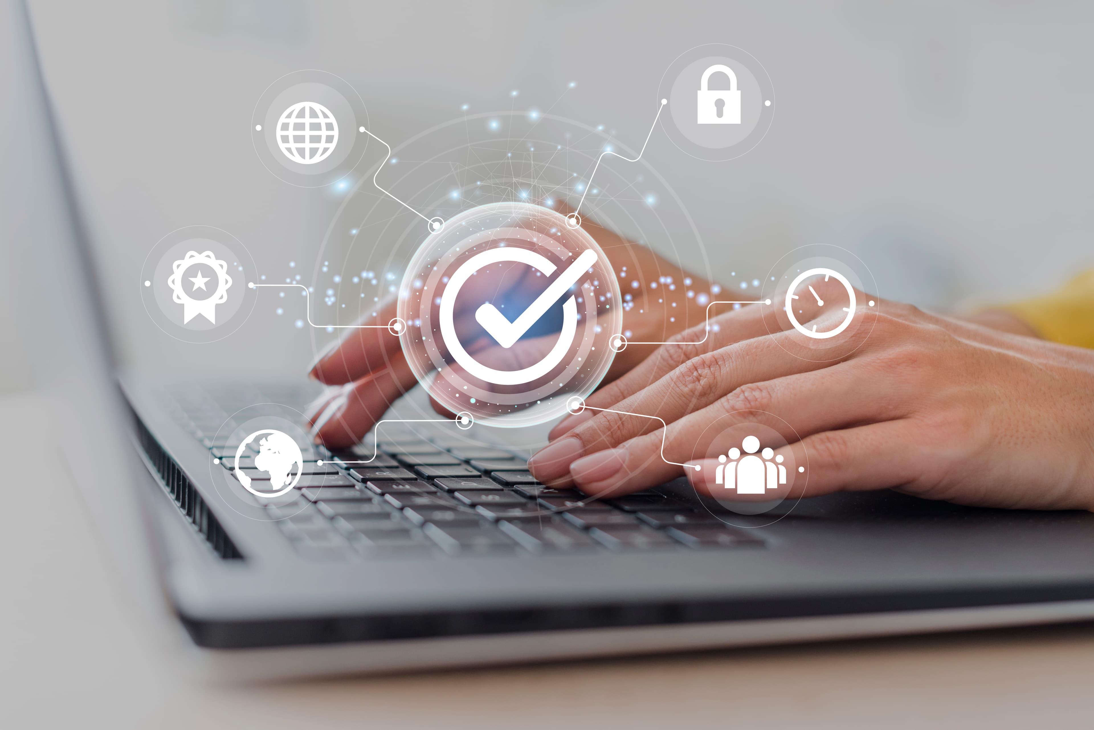 Hands typing on a laptop keyboard overlaid with data-security and privacy icons